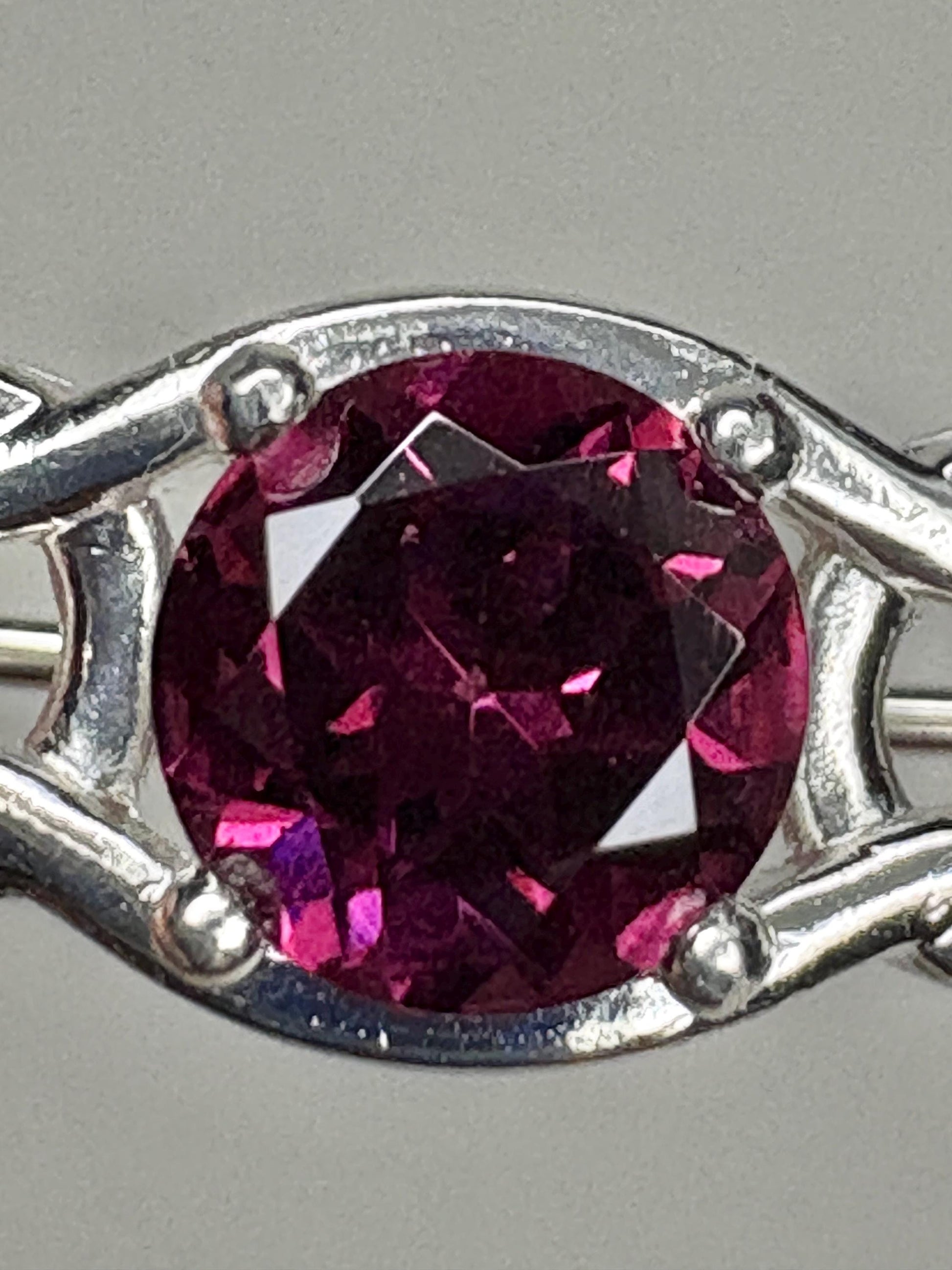 Rhodolite garnet Celtic knot brooch in sterling silver.