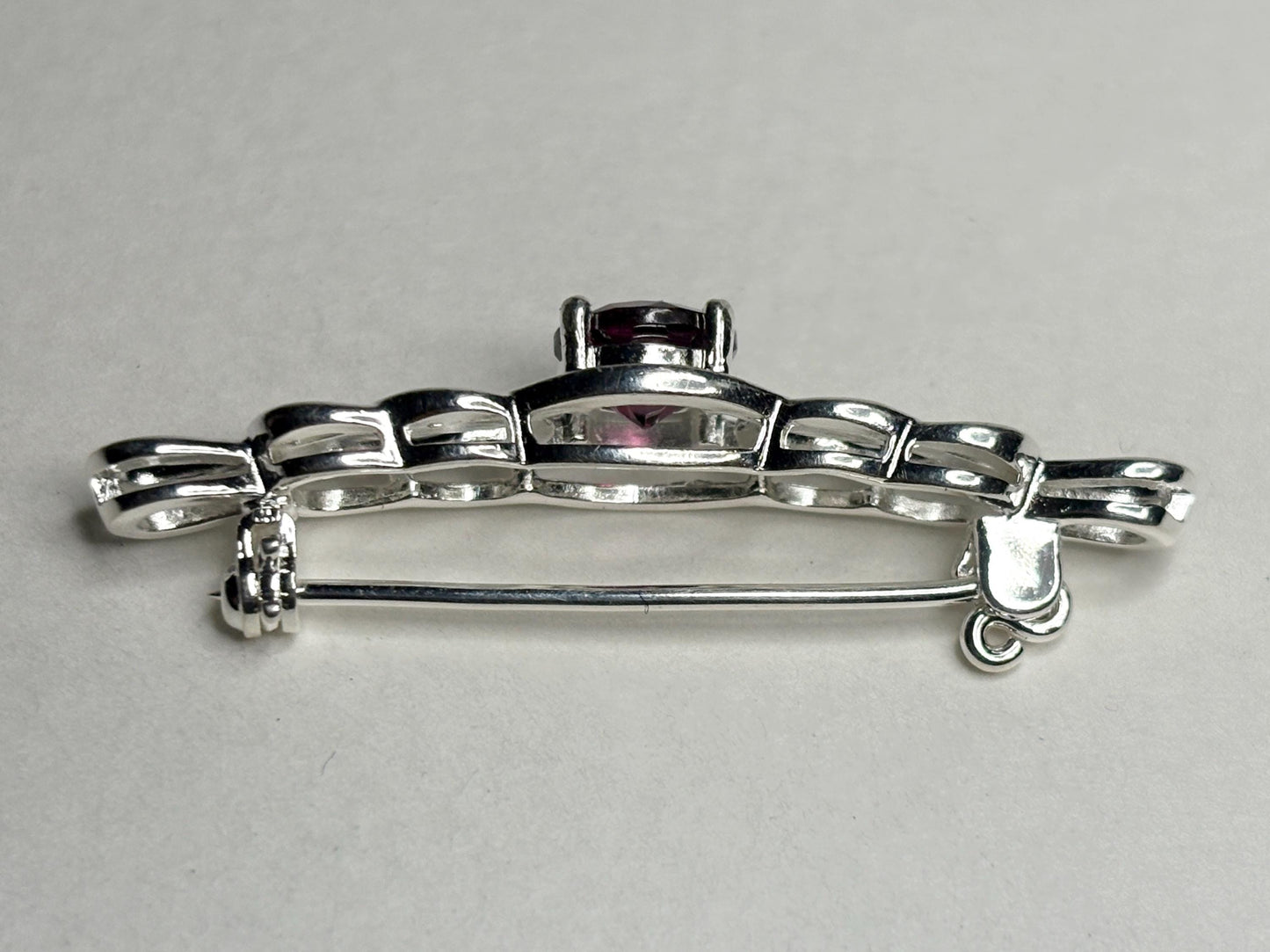 Rhodolite garnet Celtic knot bar brooch in solid sterling silver.