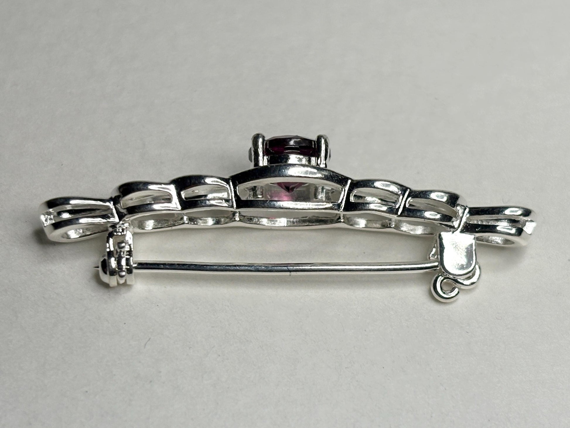 Rhodolite garnet Celtic knot bar brooch in solid sterling silver.