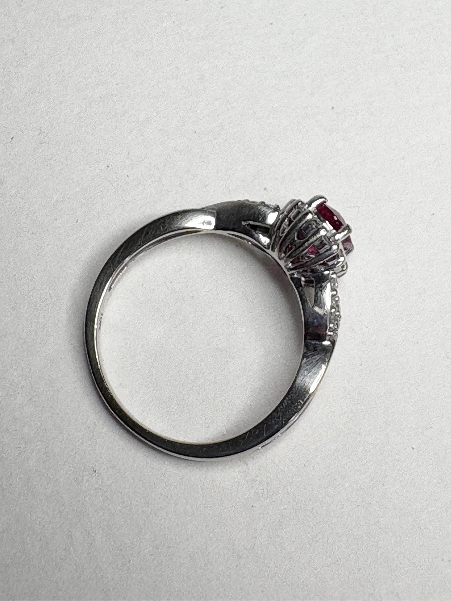 Ring with rubellite tourmaline and diamond halo in white gold.