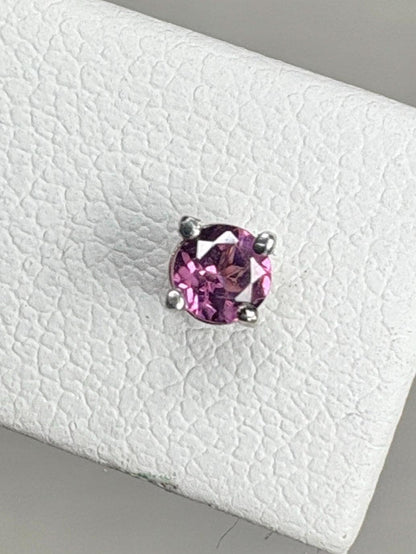 Round rhodolite garnet stud earrings in 14k white gold.