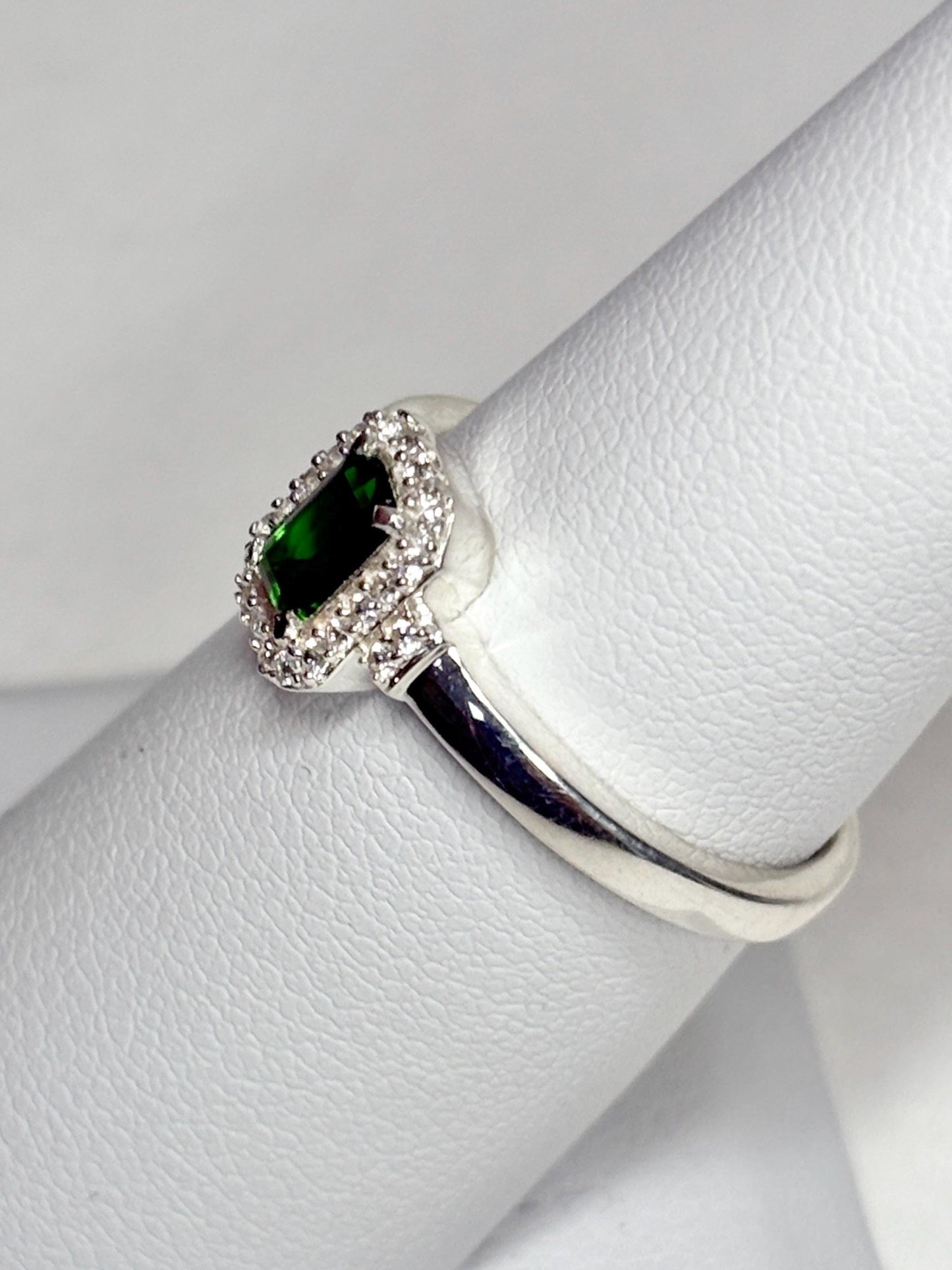 Sterling silver ring with emerald-cut chrome diopside and white zircon halo.