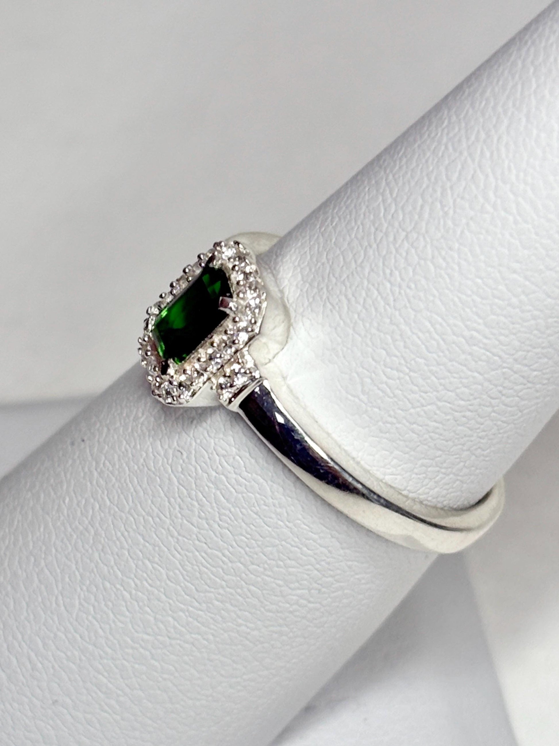 Sterling silver ring with emerald-cut chrome diopside and white zircon halo.