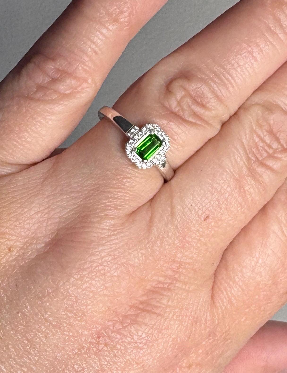 Sterling silver ring with emerald-cut chrome diopside and zircon halo.