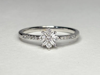 Baguette and round diamond starburst ring in 10k white gold.