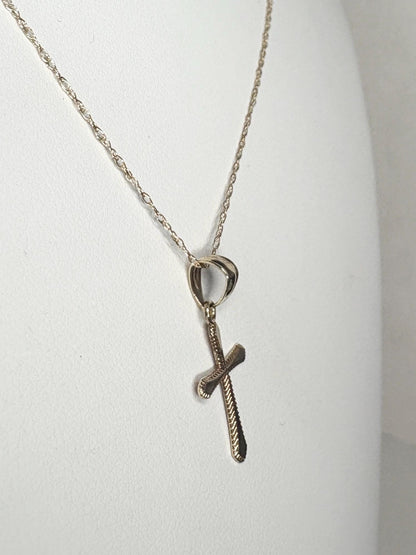 Solid 10k gold cross pendant on a 19-inch rope chain.