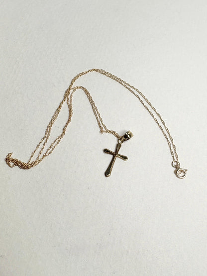 Solid 10k gold cross pendant necklace on a 19-inch rope chain.
