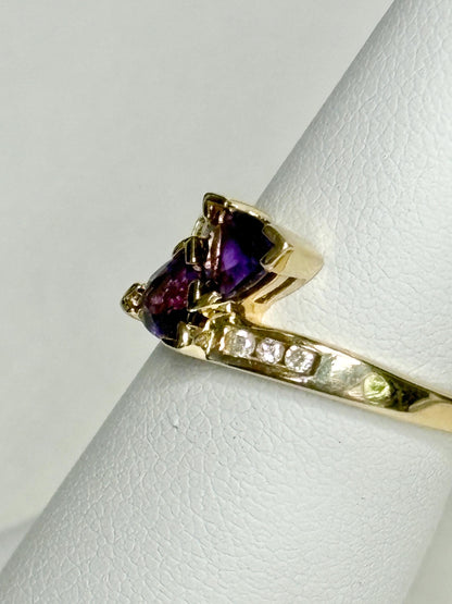 Amethyst trillion bypass ring with diamonds in solid 10k gold.