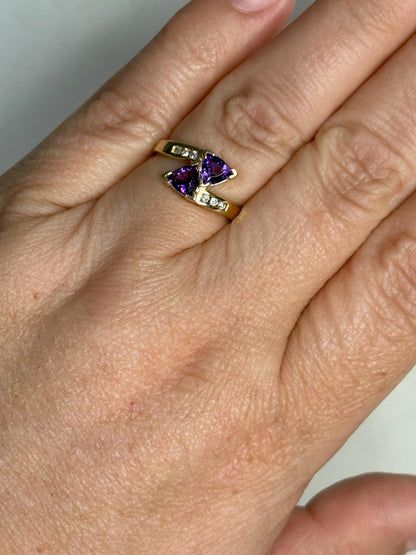Amethyst trillion bypass ring with diamonds in 10k gold.
