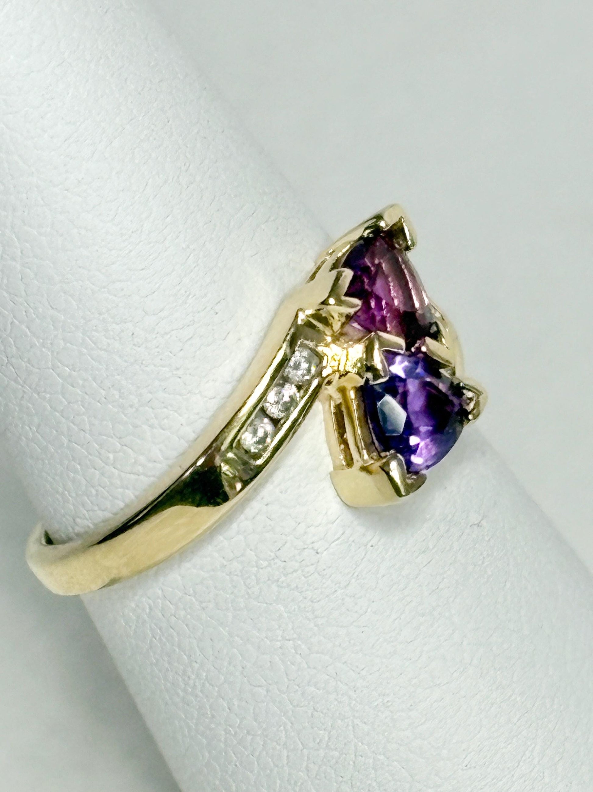 Amethyst trillion bypass ring with diamonds in 10k gold.