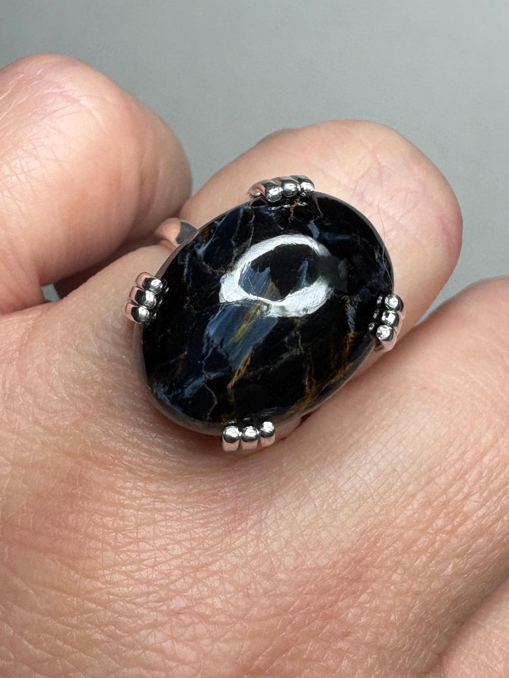 Sterling silver ring with a large oval Arizona pietersite gemstone.