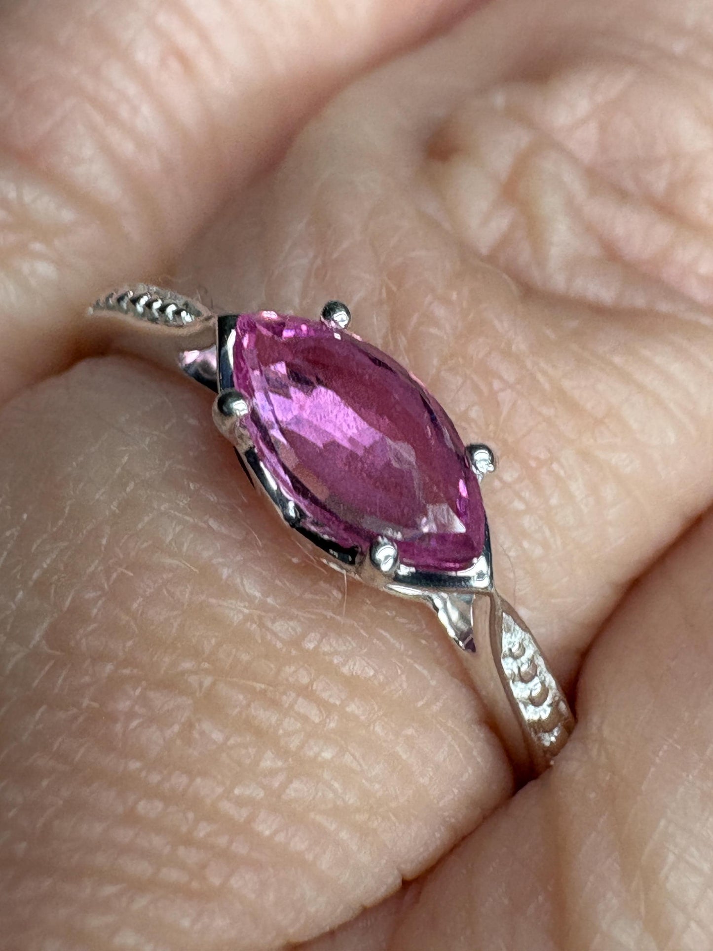 Sterling silver ring with a rose-cut marquise pink sapphire and beaded band.