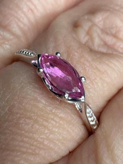 Sterling silver ring with a rose-cut marquise pink sapphire and beaded band.