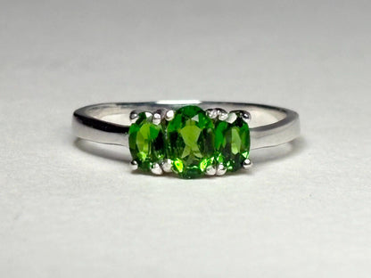 Sterling silver ring with three oval chrome diopside stones.