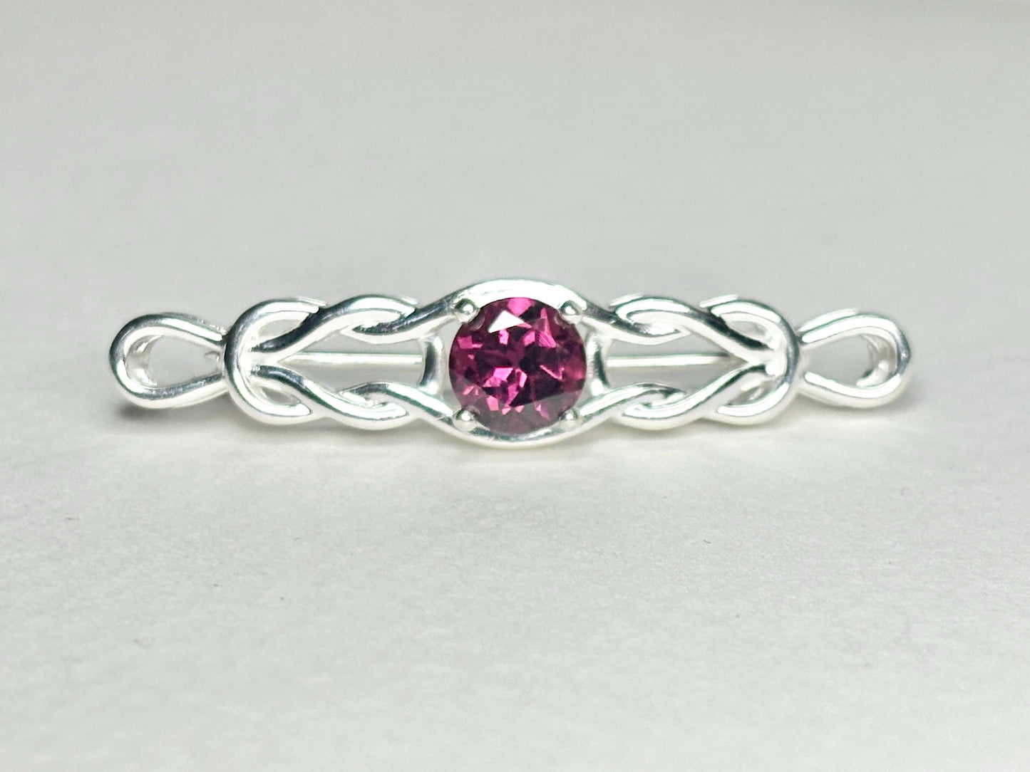 Rhodolite garnet Celtic knot bar brooch in sterling silver.