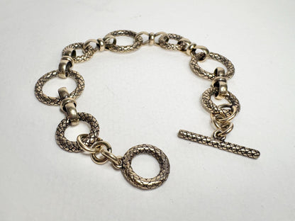 Vintage solid bronze adjustable link bracelet with toggle clasp.