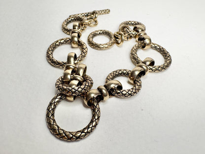 Vintage solid bronze adjustable link bracelet with toggle clasp.