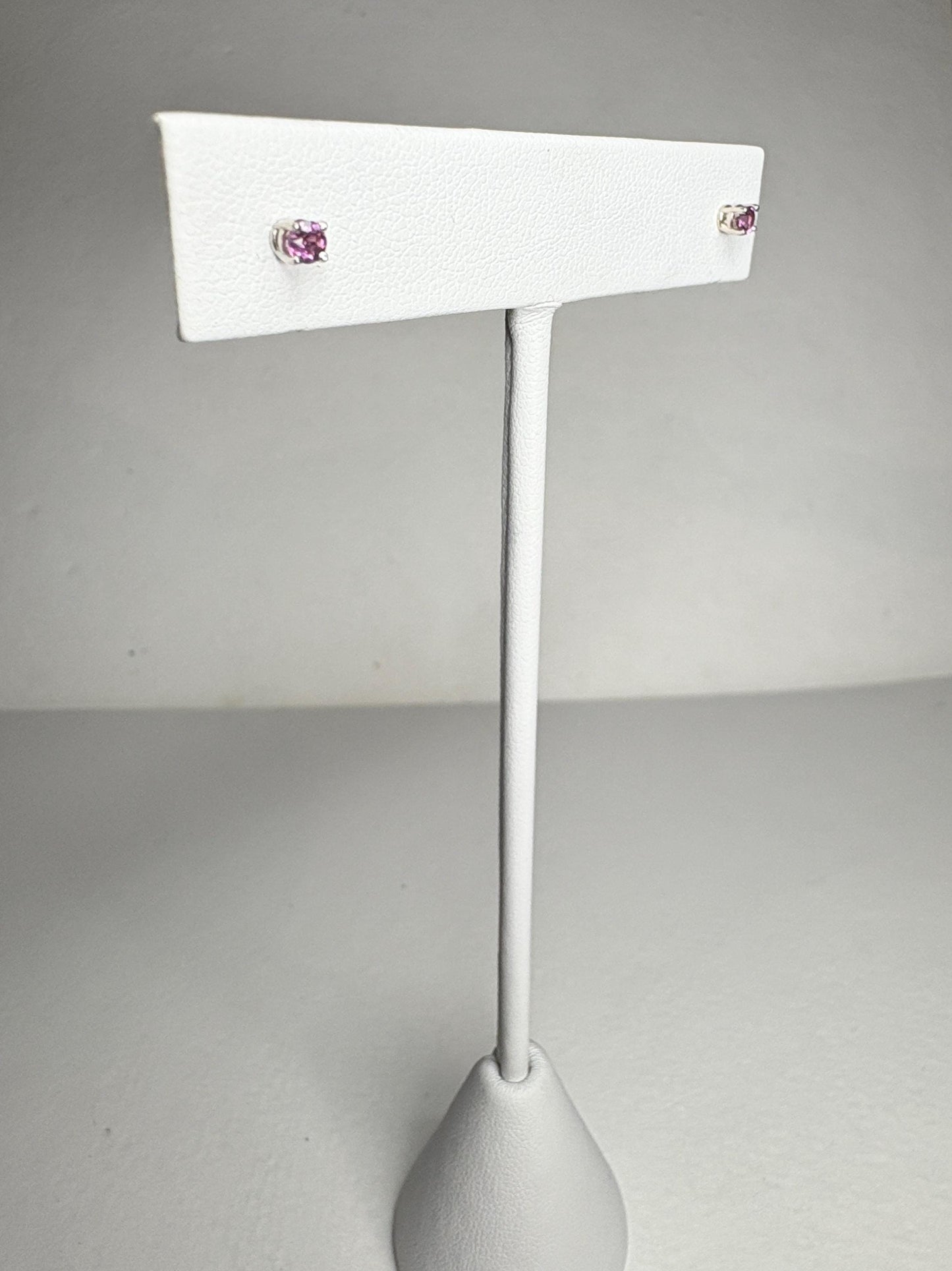 Solid 14k white gold stud earrings with round rhodolite garnets.