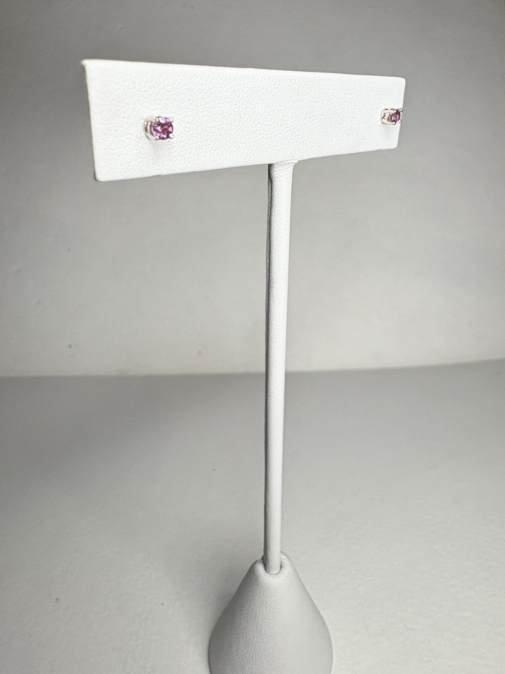 Solid 14k white gold stud earrings with round rhodolite garnets.