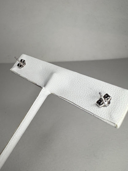 Rhodolite garnet stud earrings in 14k white gold.