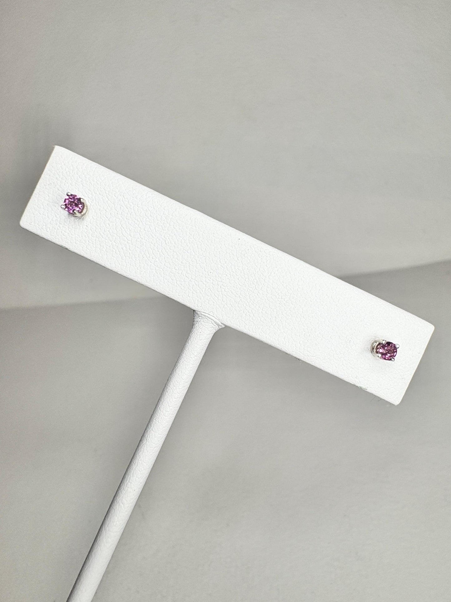 Premium rhodolite garnet stud earrings in solid 14k white gold.
