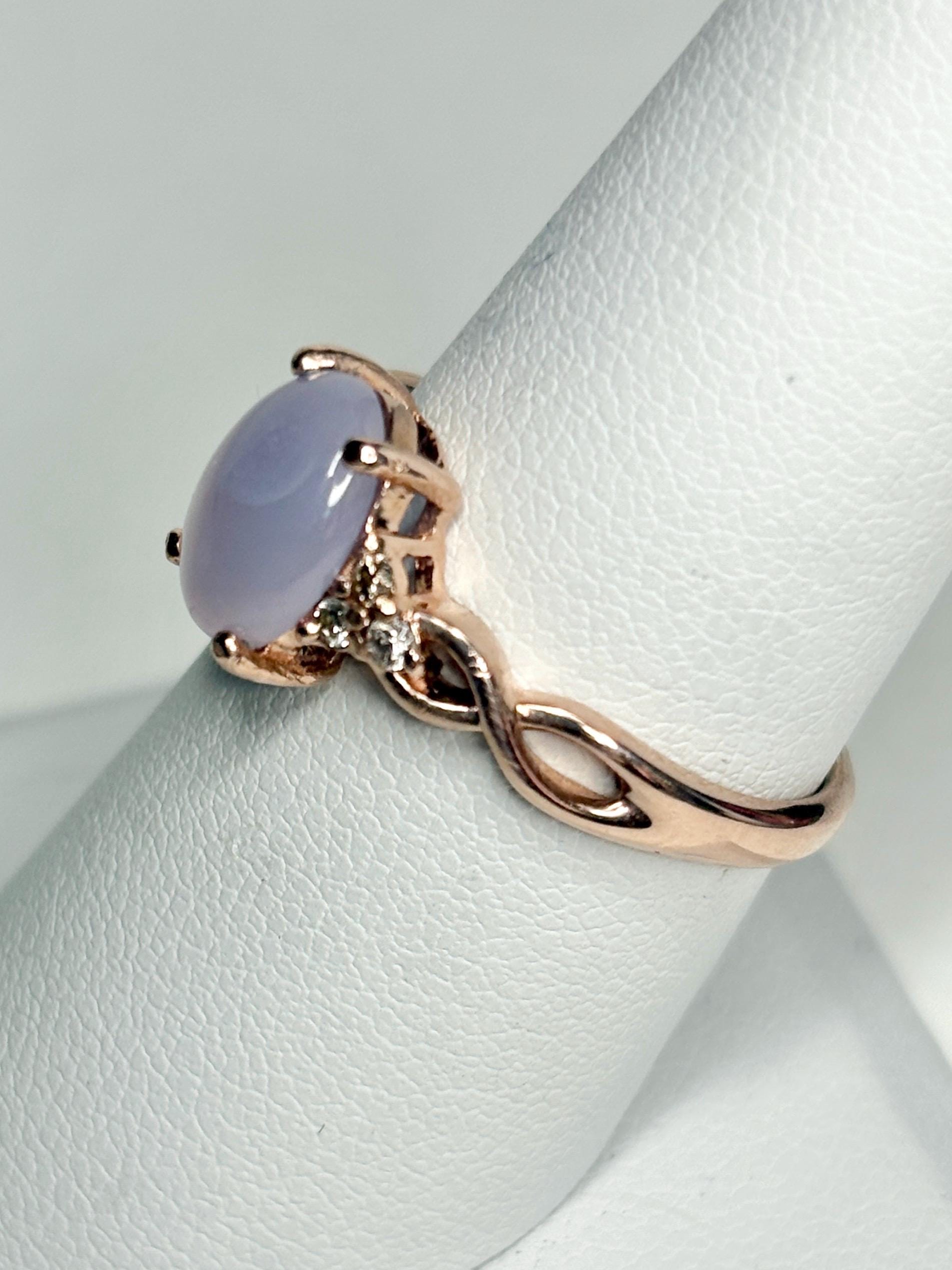 Oval blue chalcedony and diamond ring in rose gold.