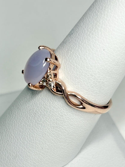 Oval blue chalcedony and diamond ring in rose gold.