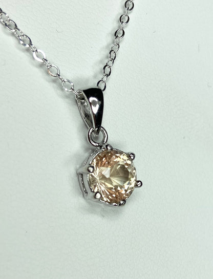 Oregon Sunstone pendant necklace with a round, 7mm, 1.51ct sunstone in a sterling silver setting.