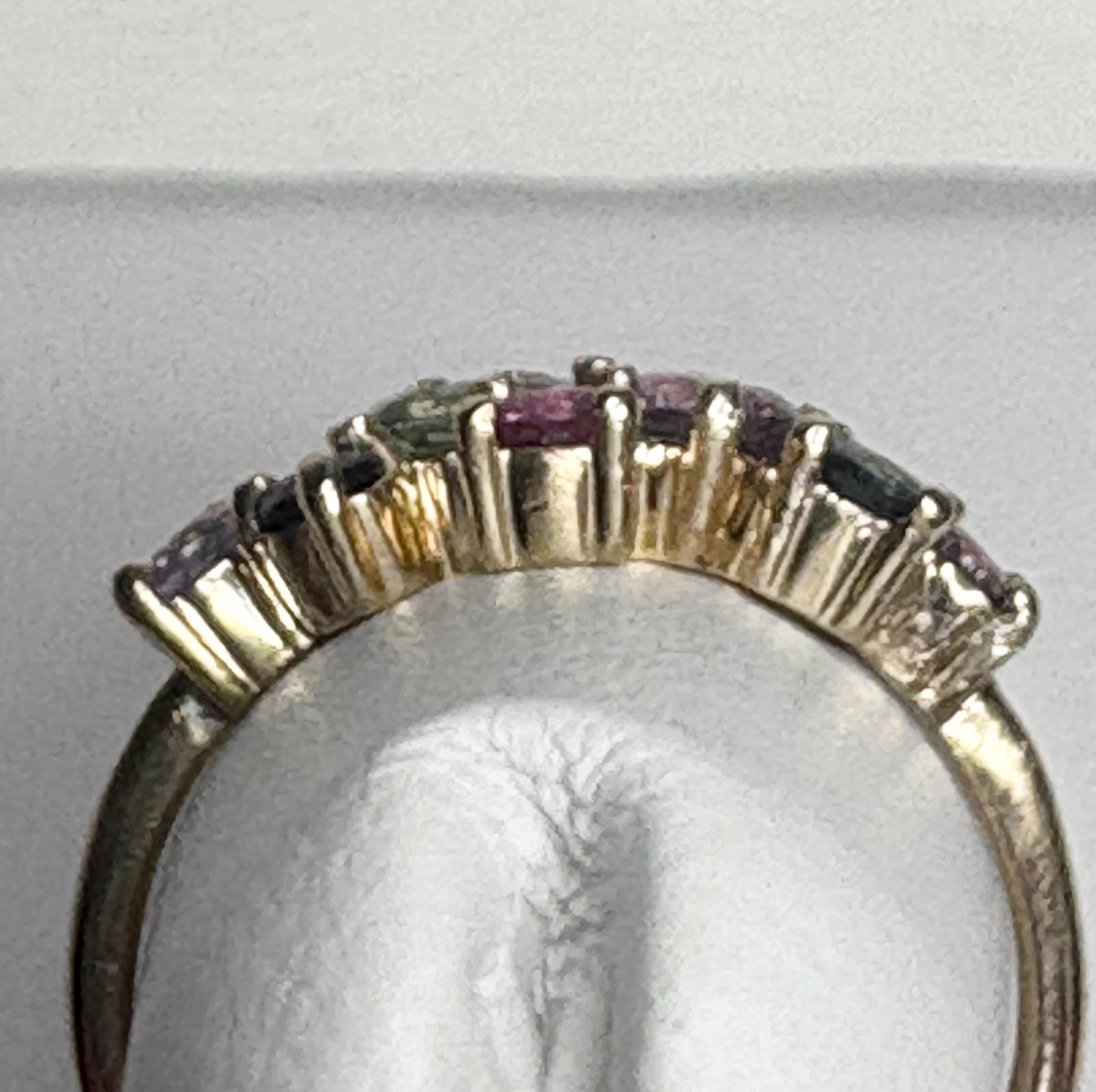 A 10k gold ring with multiple colored sapphires.