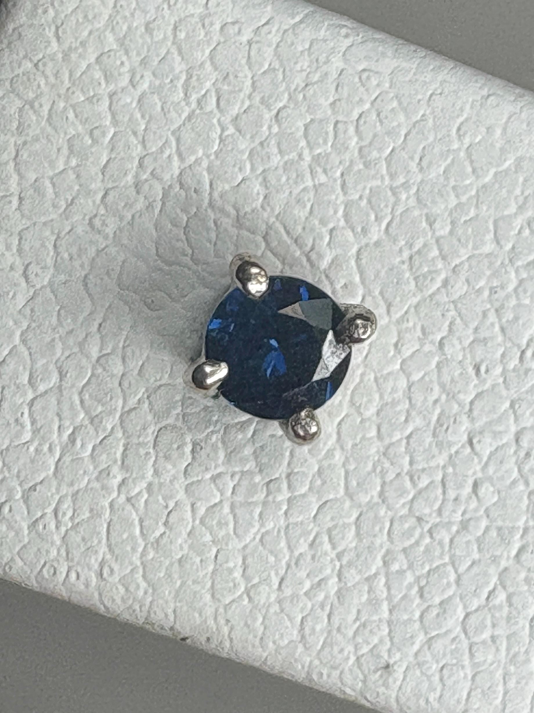 Natural dark blue sapphire stud earrings in solid 14k white gold.