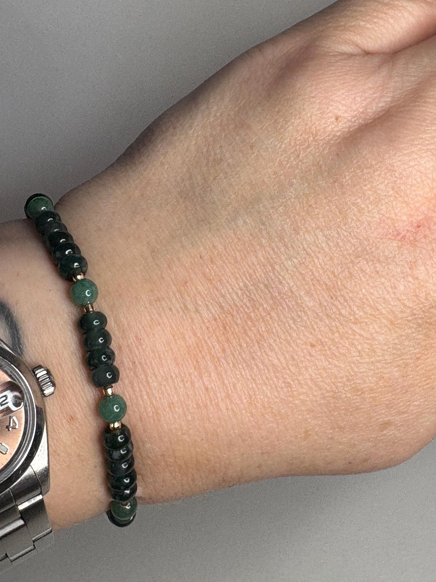 Natural untreated Type A jadeite jade stretch bracelet with solid 14k gold beads.