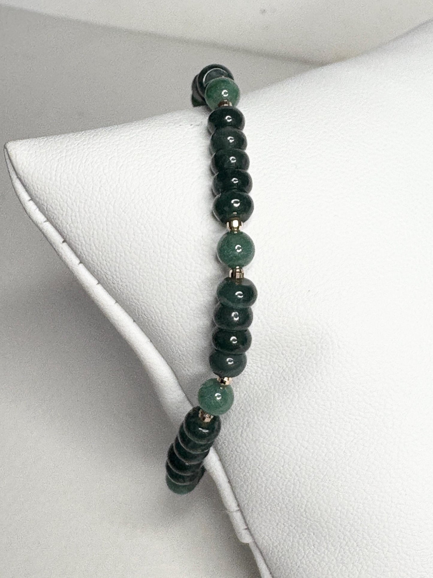 Natural untreated Type A jadeite jade stretch bracelet with solid 14k gold beads.
