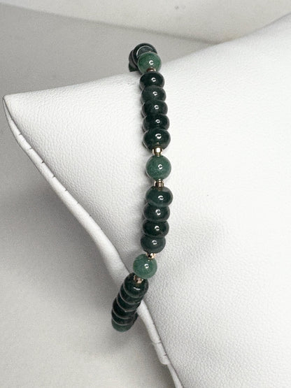 Natural untreated Type A jadeite jade stretch bracelet with solid 14k gold beads.