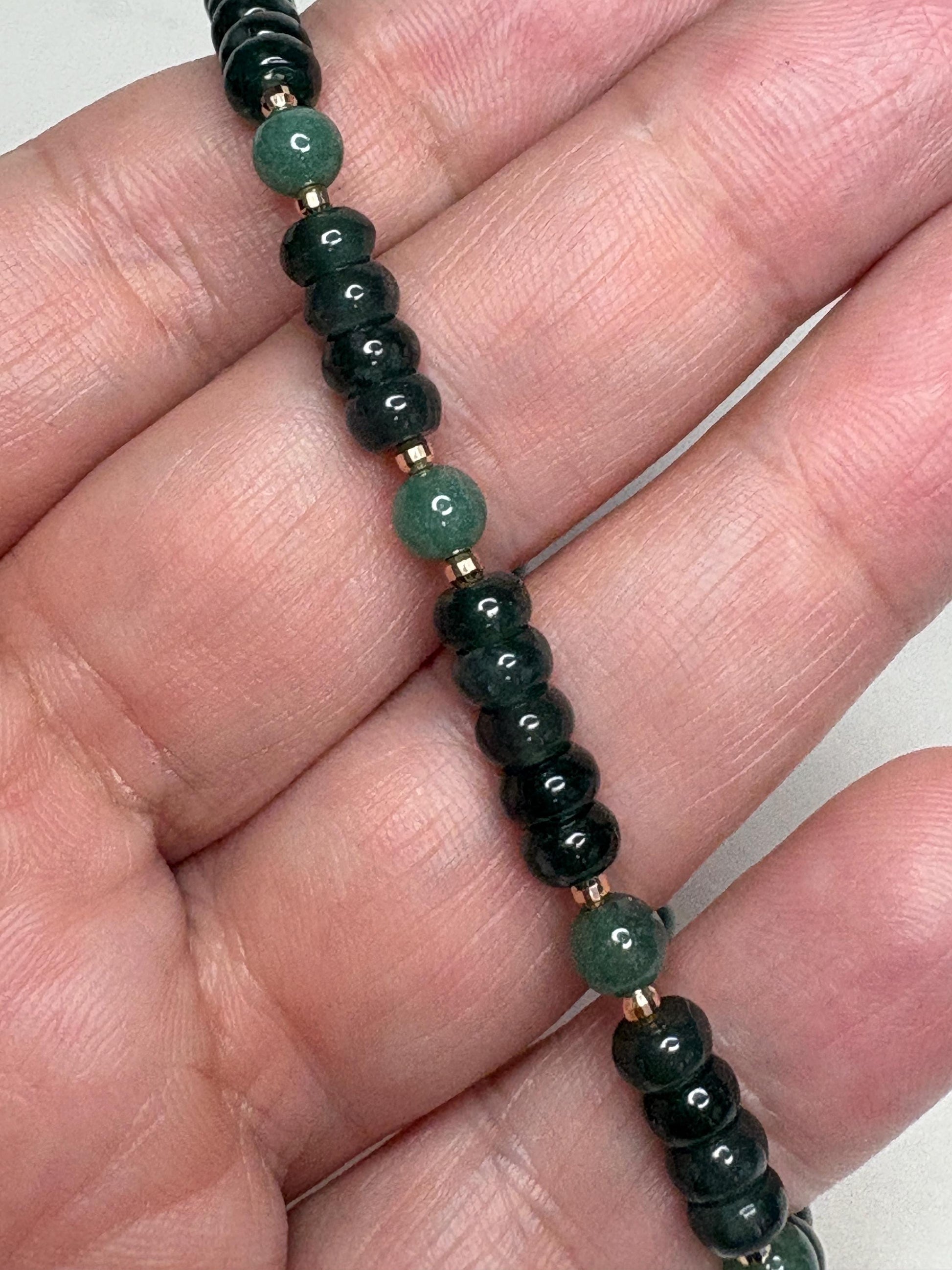 Natural untreated Type A jadeite jade stretch bracelet with solid 14k gold beads.