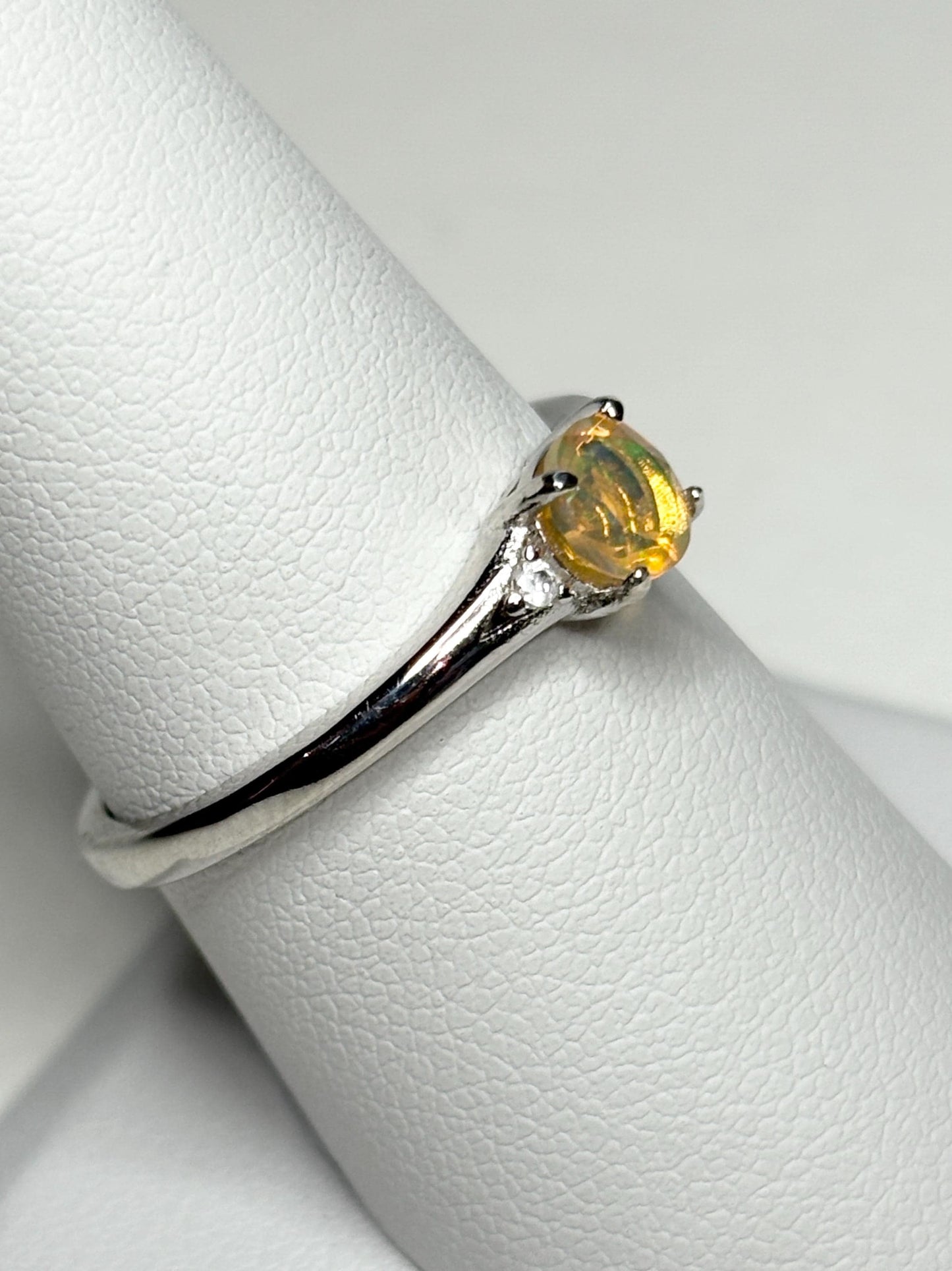 Sterling silver ring with a golden Ethiopian opal solitaire.