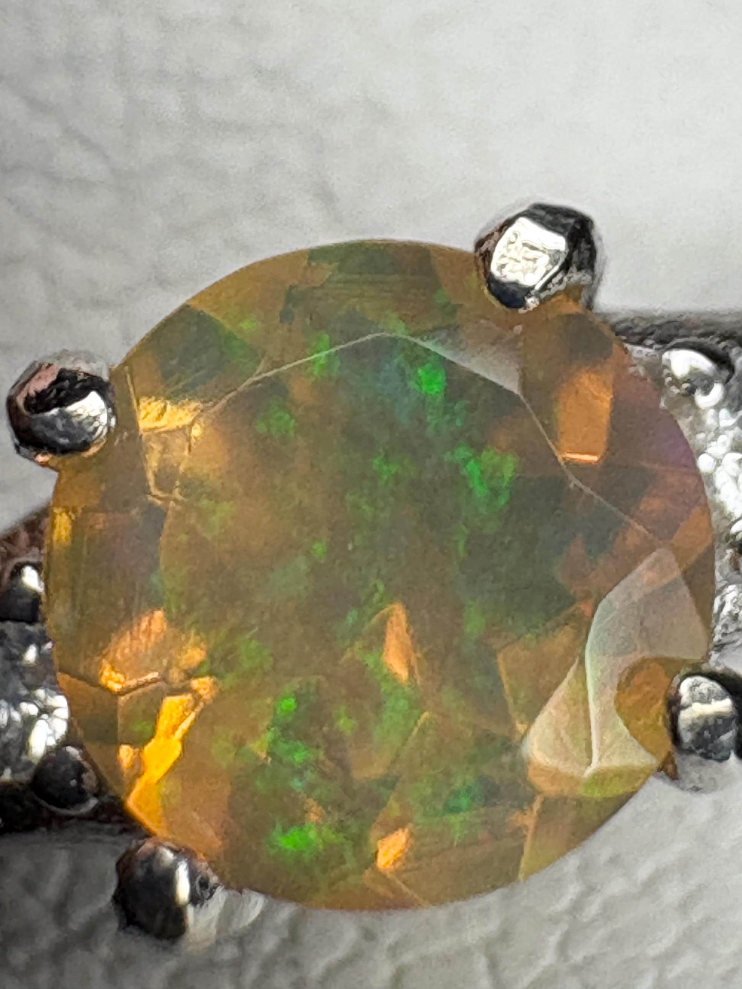 Ethiopian opal solitaire ring in sterling silver.