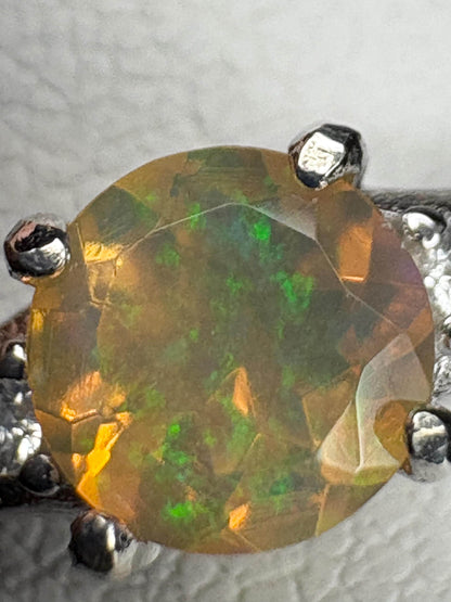Ethiopian opal solitaire ring in sterling silver.