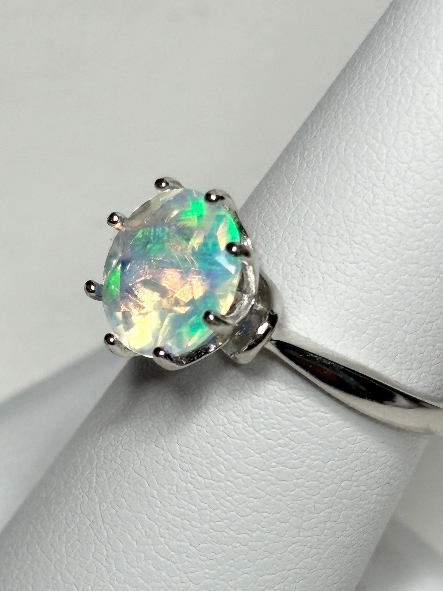 Sterling silver ring with a faceted Ethiopian crystal opal.