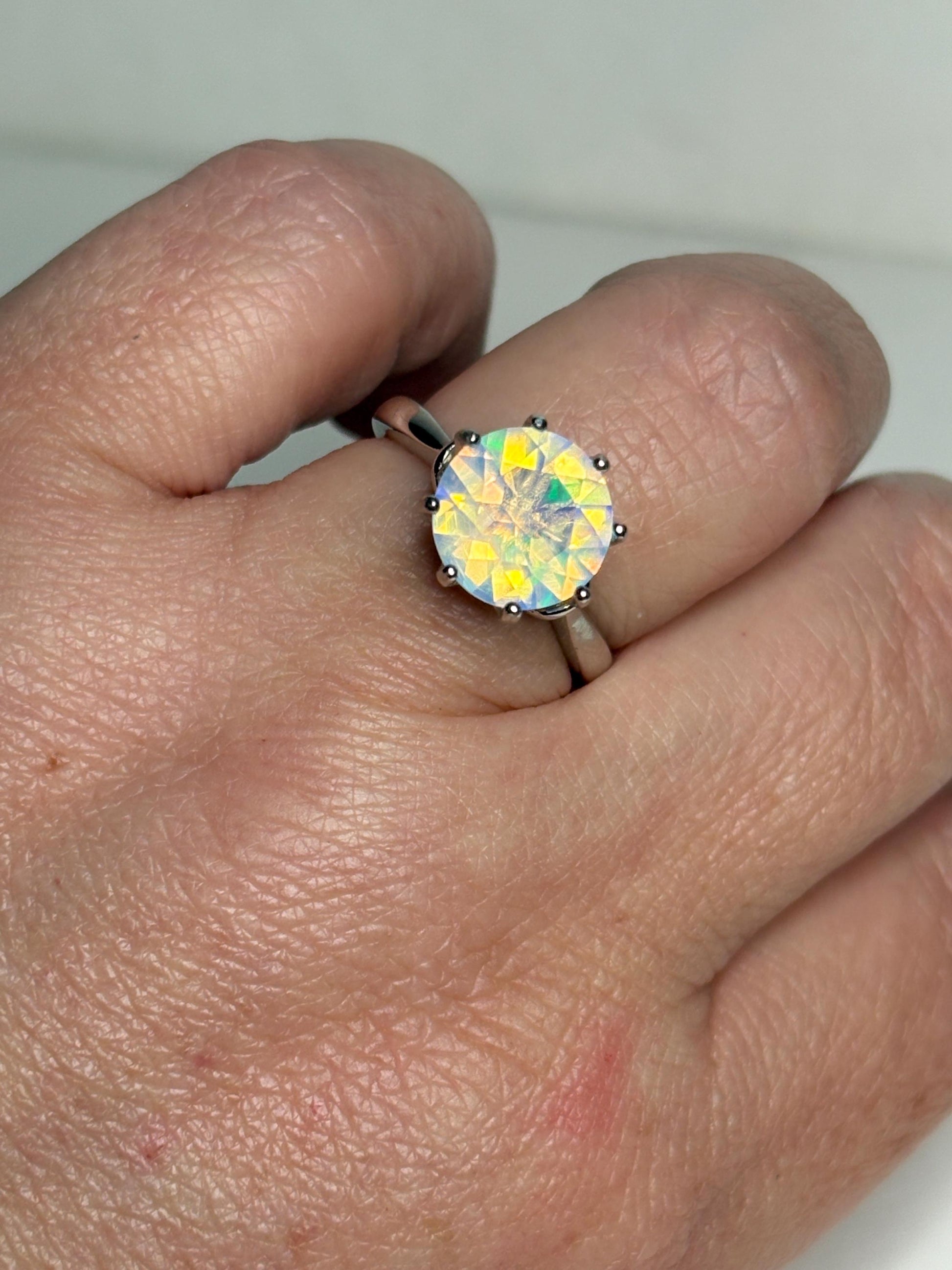 Sterling silver ring with a faceted Ethiopian opal gemstone.