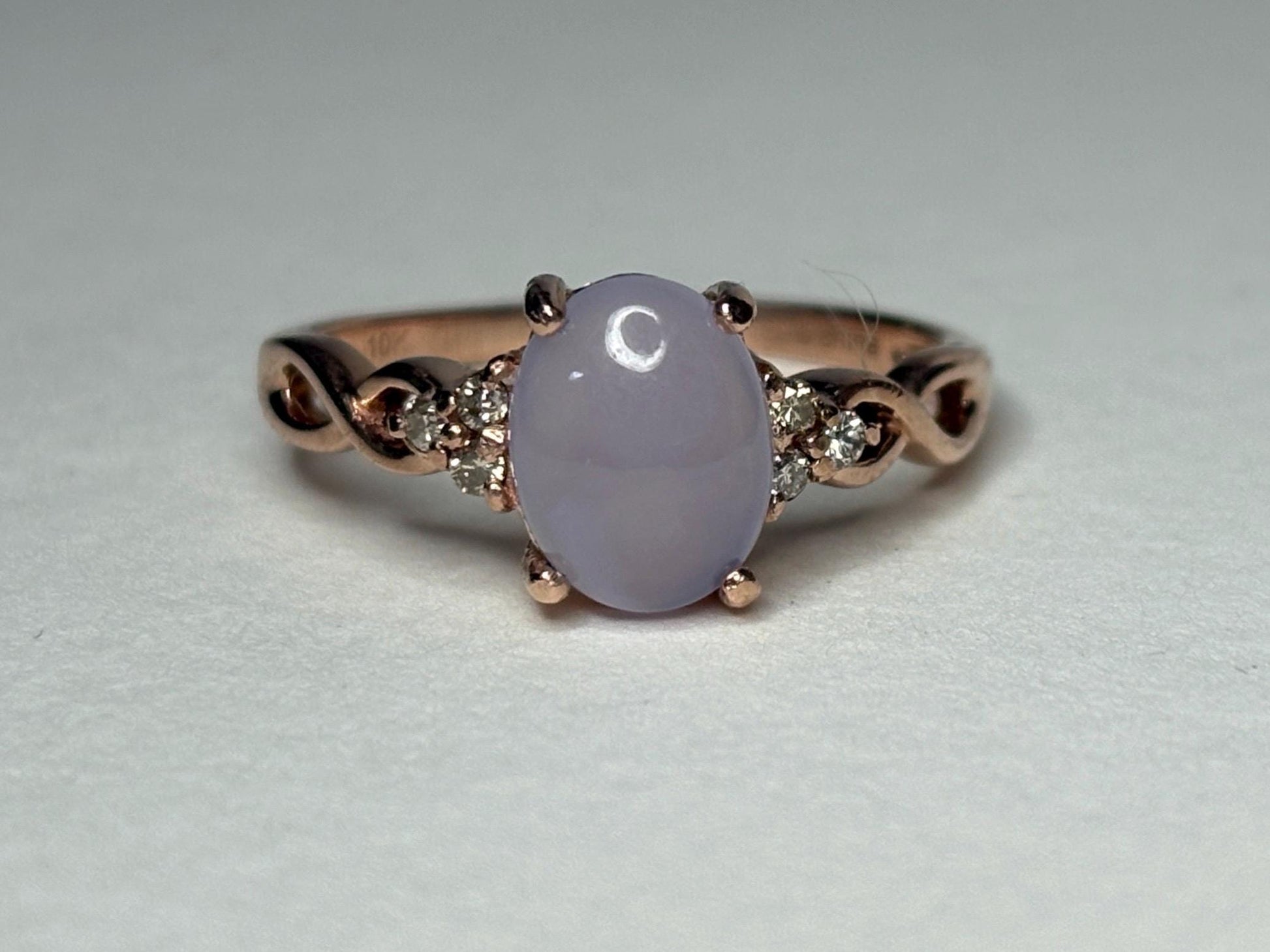 Oval blue chalcedony and diamond ring in rose gold.