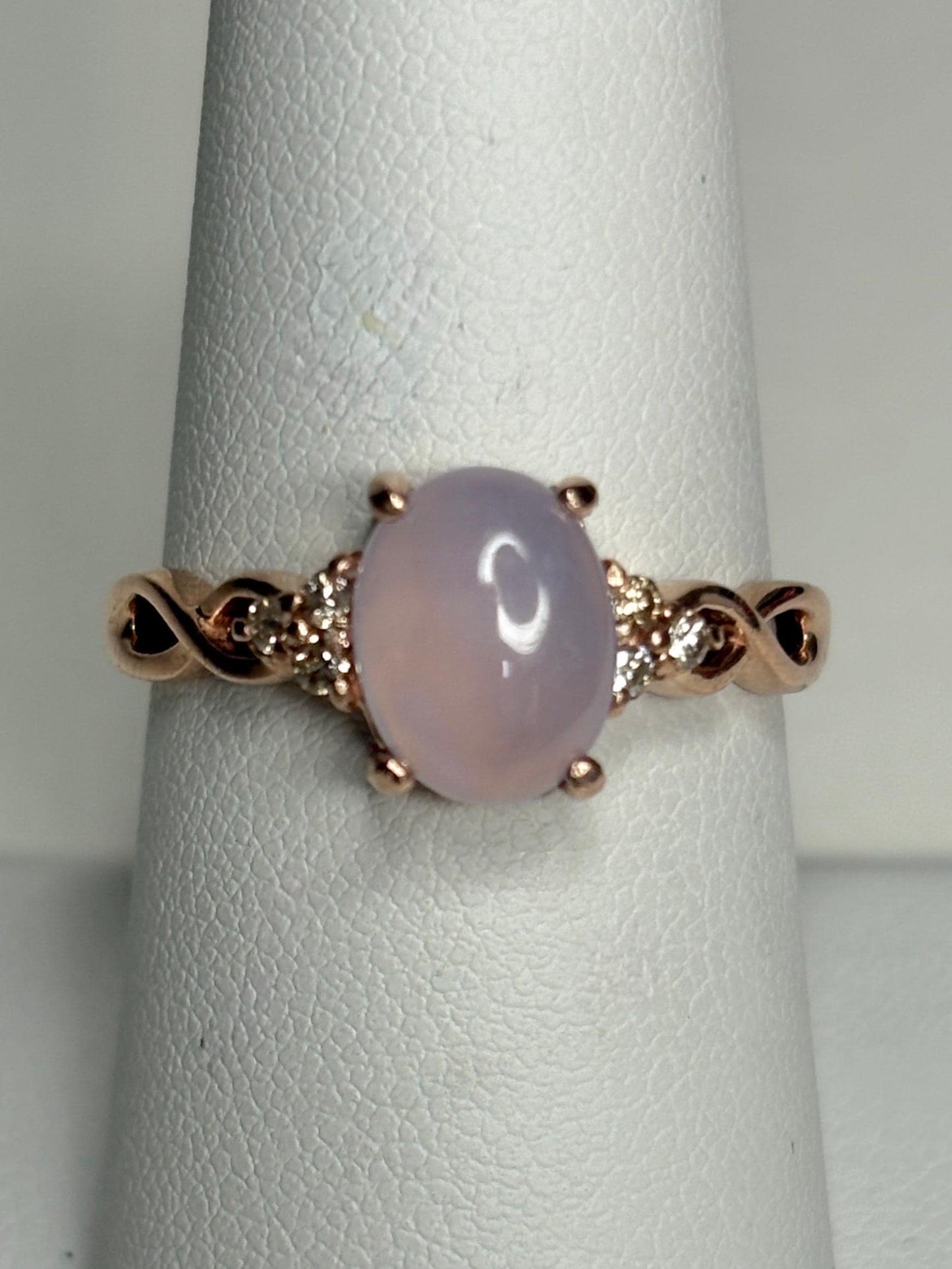 Oval blue chalcedony and diamond ring in rose gold.