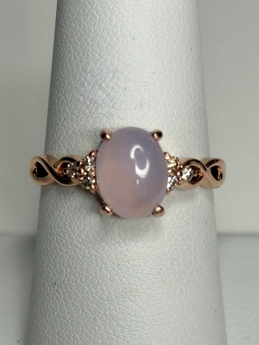 Oval blue chalcedony and diamond ring in rose gold.