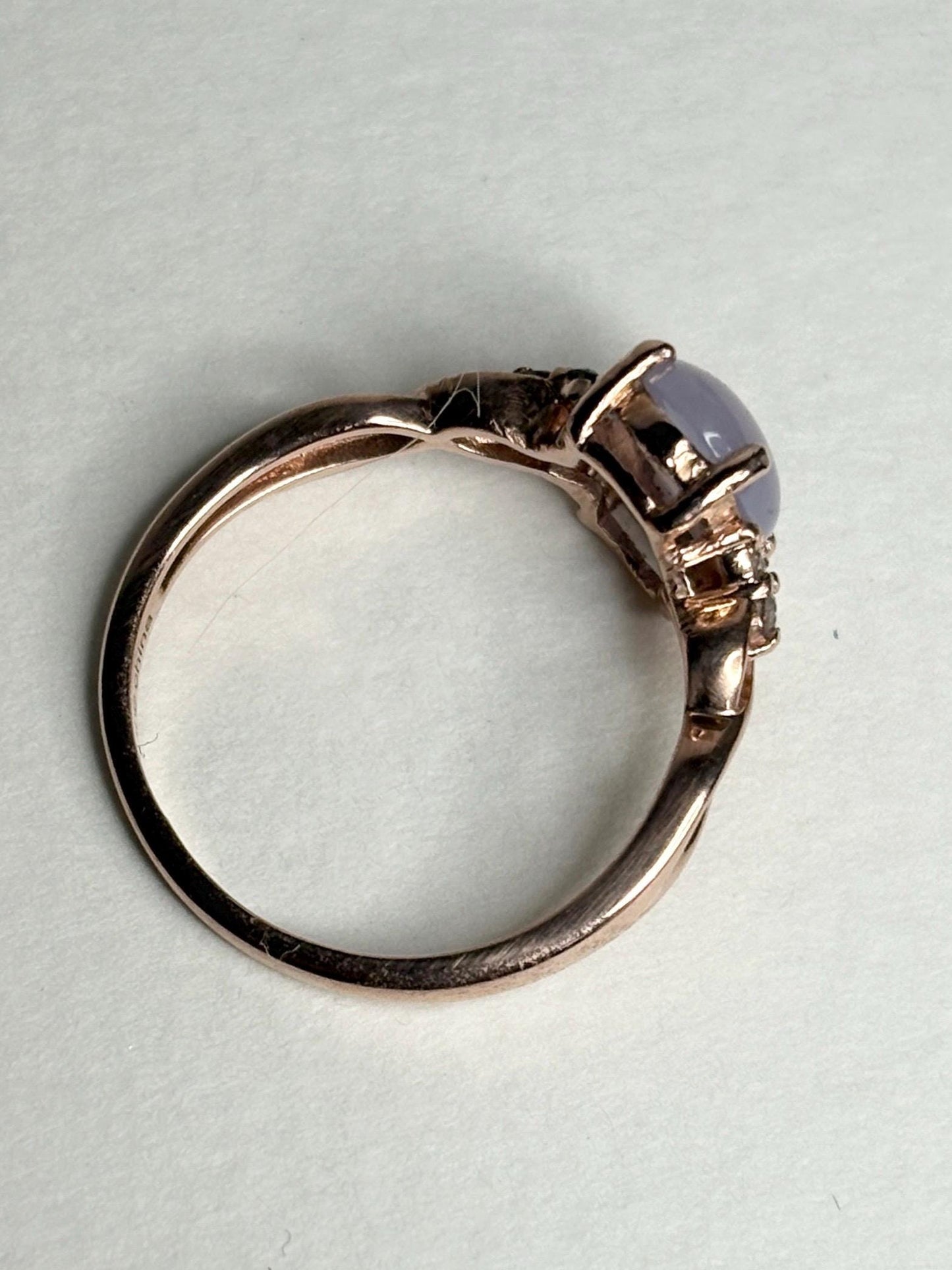 Rose gold ring with a blue chalcedony agate and diamonds.