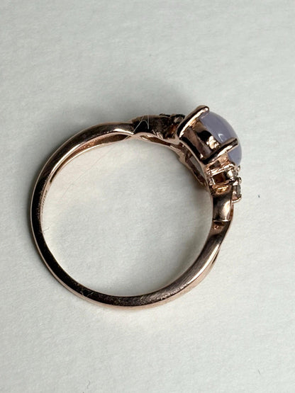 Rose gold ring with a blue chalcedony agate and diamonds.