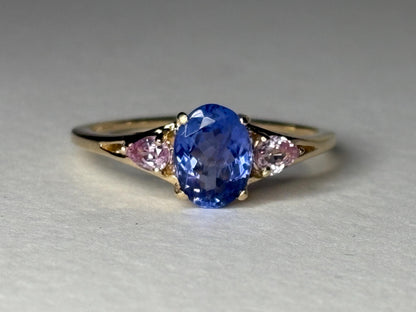 Oval tanzanite and pear pink sapphire ring in 9k gold.