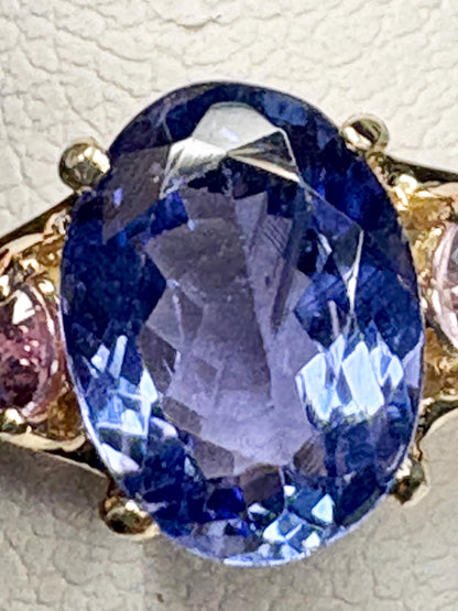 Oval tanzanite and pink sapphire ring in 9k gold.