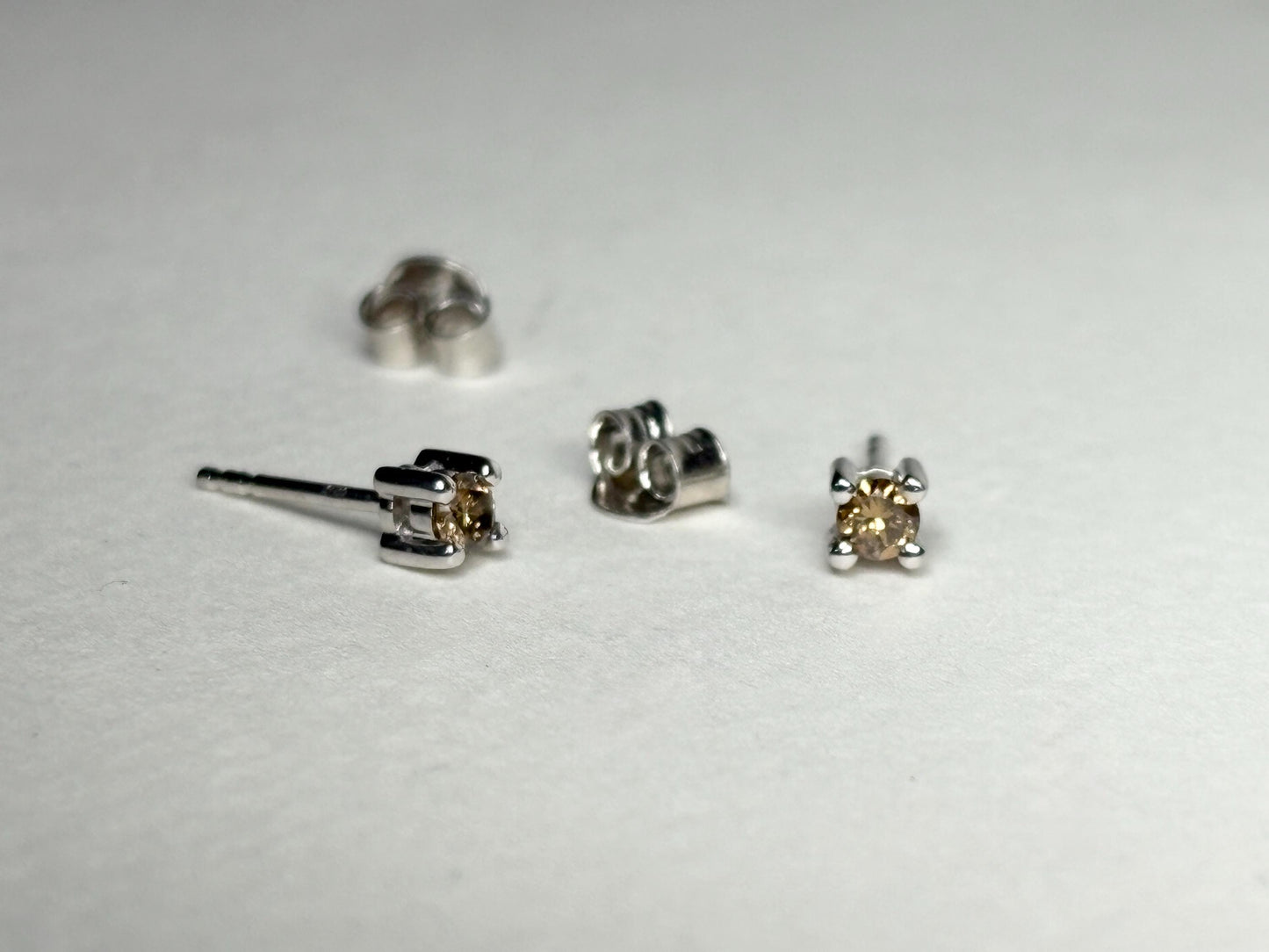 Sterling silver stud earrings with 3mm chocolate champagne colored natural diamonds.