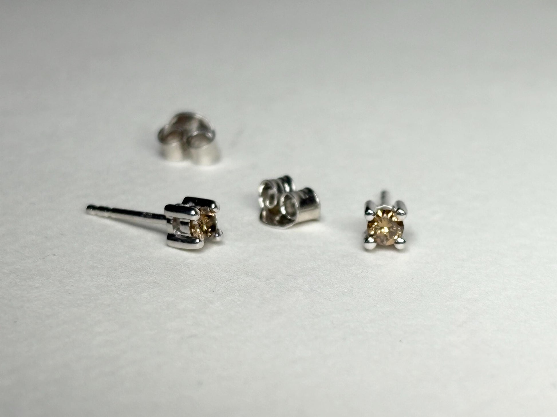 Sterling silver stud earrings with 3mm chocolate champagne colored natural diamonds.