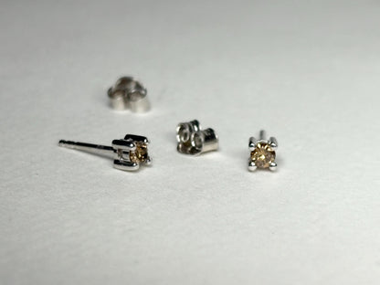 Sterling silver stud earrings with 3mm chocolate champagne colored natural diamonds.