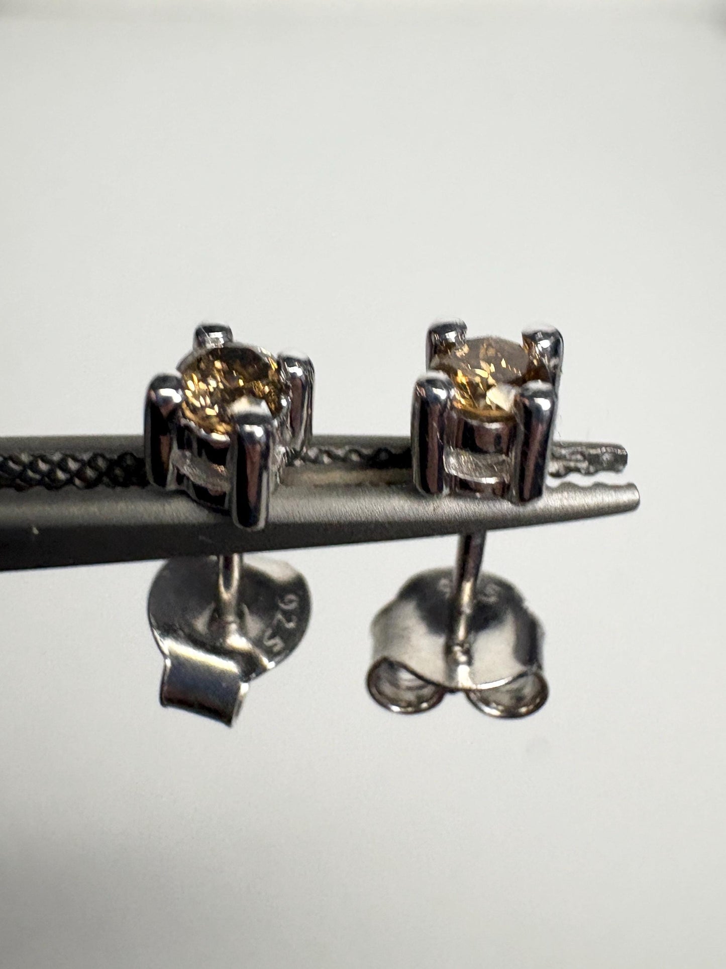 Chocolate champagne colored natural diamond stud earrings in sterling silver.